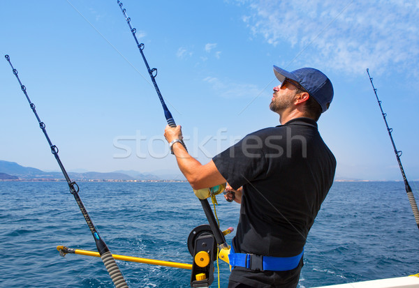 Niebieski morza rybaka trolling łodzi działania Zdjęcia stock © lunamarina