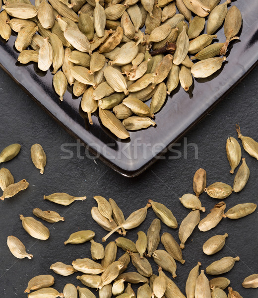 Stock photo: cardamom pods on black background