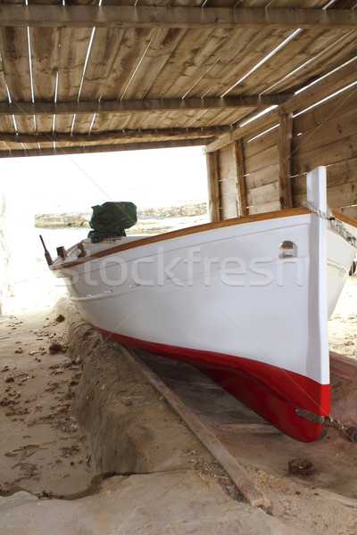 Formentera boat stranded on wooden rails Stock photo © lunamarina