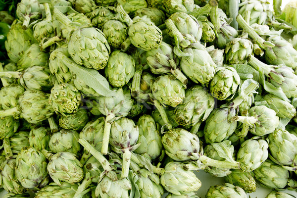 artichokes vegetables in a market mound Stock photo © lunamarina