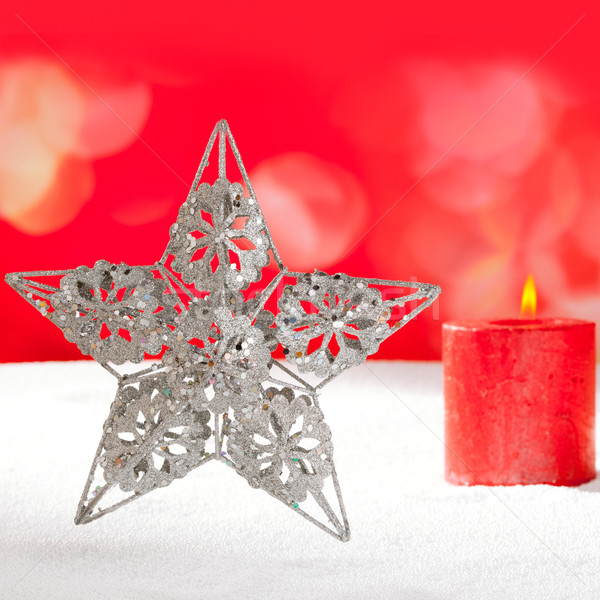 Christmas card of silver star and candle on snow Stock photo © lunamarina