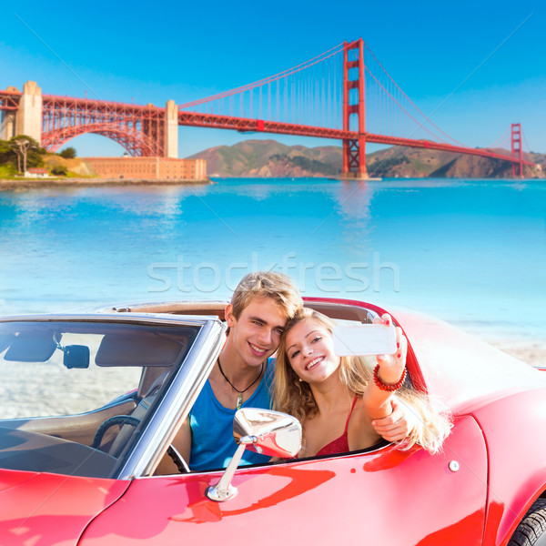 selfie of young couple convertible car Golden Gate Stock photo © lunamarina