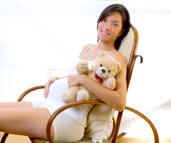 Piękna kobieta w ciąży posiedzenia miś biegun krzesło Zdjęcia stock © lunamarina