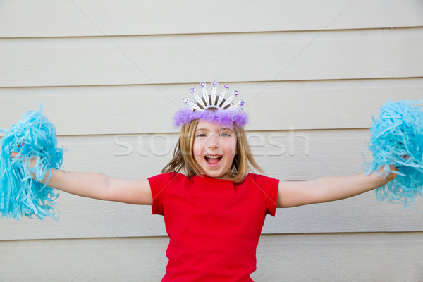 Blond kid girl playing like cheerleading pom poms and crown Stock photo © lunamarina