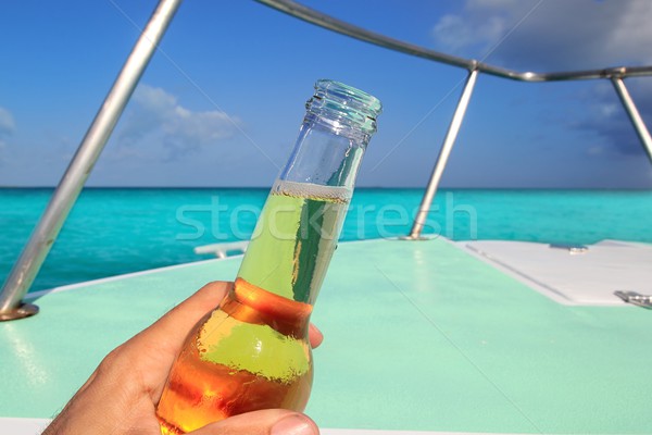 啤酒 手 加勒比的 船 弓 綠松石 商業照片 © lunamarina