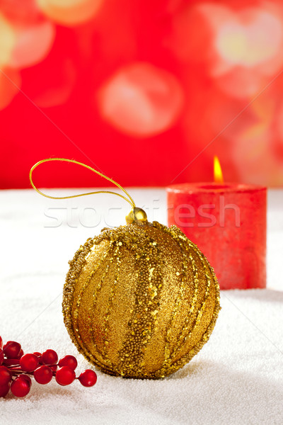 Christmas card of golden baubleand candle Stock photo © lunamarina