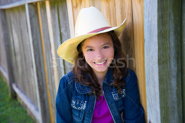 Little kid girl pretending to be a cowboy with hat Stock photo © lunamarina