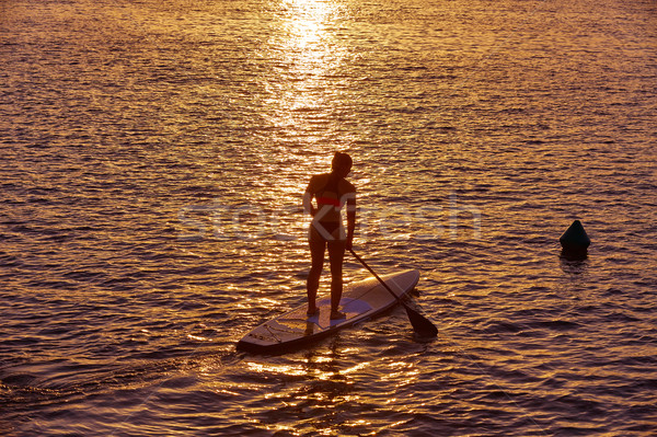 SUP Stand up Surf girl with paddle Stock photo © lunamarina