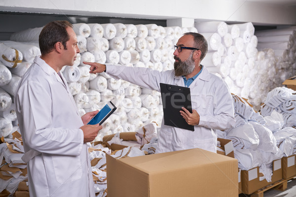 warehouse supervisor and manager men with textile Stock photo © lunamarina