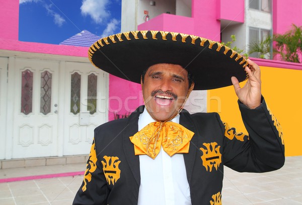 Charro mariachi portrait singing in mexican house Stock photo © lunamarina