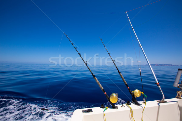 Ibiza fishing boat trolling rods and reels in blue sea Stock photo © lunamarina