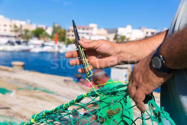 Majorca Cala Ratjada fisherman sewing fishing net Stock photo © lunamarina
