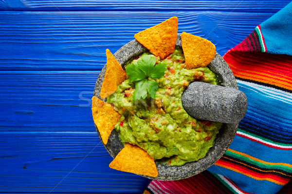 Guacamole with nachos in Mexican molcajete Stock photo © lunamarina