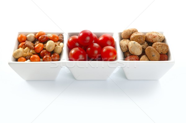 triple bowl with varied japanese snacks and tomatoes Stock photo © lunamarina