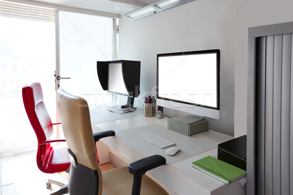 Designer office desk with computer screens Stock photo © lunamarina