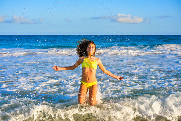 Bikini girl jumping in Caribbean sunset beach Stock photo © lunamarina