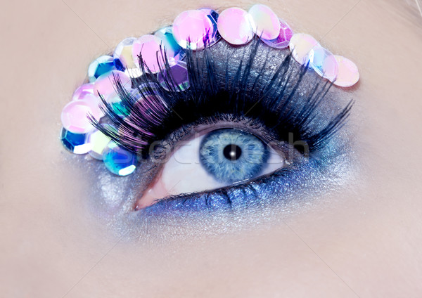 Blue eye macro closeup makeup sequins colorful Stock photo © lunamarina