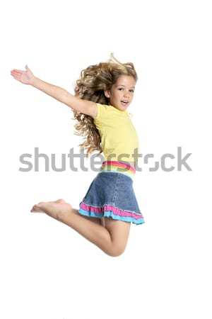 Fata frumoasa zbura jumping izolat alb Imagine de stoc © lunamarina
