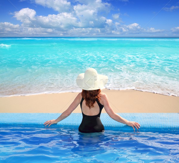 Stock photo: Caribbean sea view from blue pool rear woman