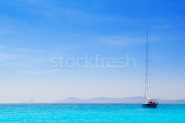 Ibiza mountains with sailboat from Formentera Stock photo © lunamarina