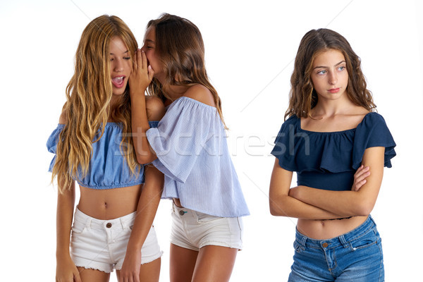 Teen best friends bullying a girl sad apart Stock photo © lunamarina