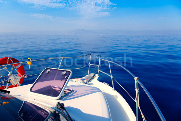 Blue sea boat sailing with open bow porthole Stock photo © lunamarina