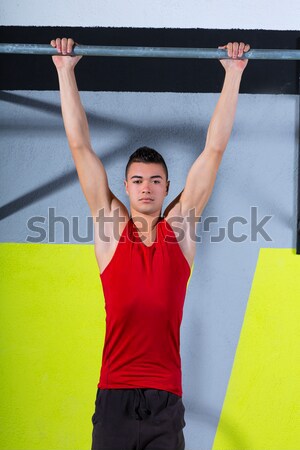 Crossfit rope climb exercise in fitness gym Stock photo © lunamarina