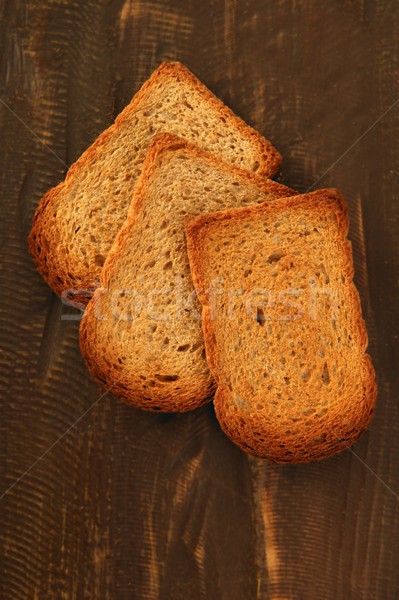 Opiekany chleba plastry starych ciemne drewna Zdjęcia stock © lunamarina