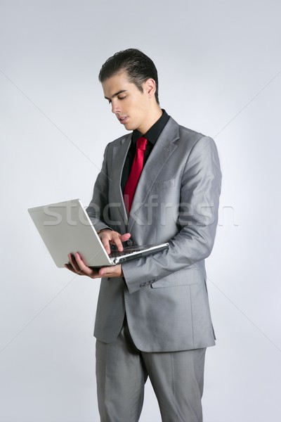 Stockfoto: Zakenman · grijs · pak · laptop · laptop · computer