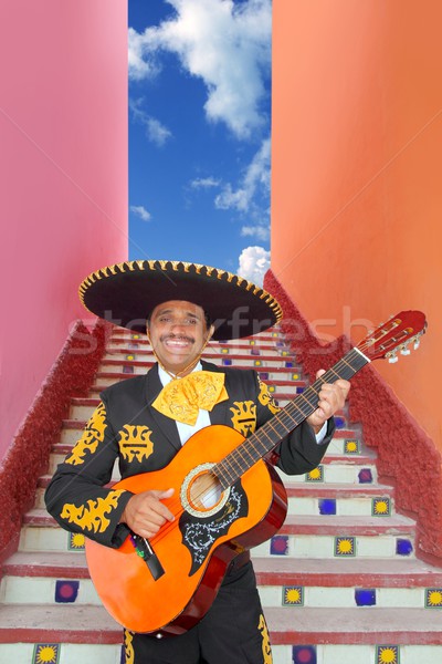 Charro Mariachi playing guitar in Mexico stairway Stock photo © lunamarina