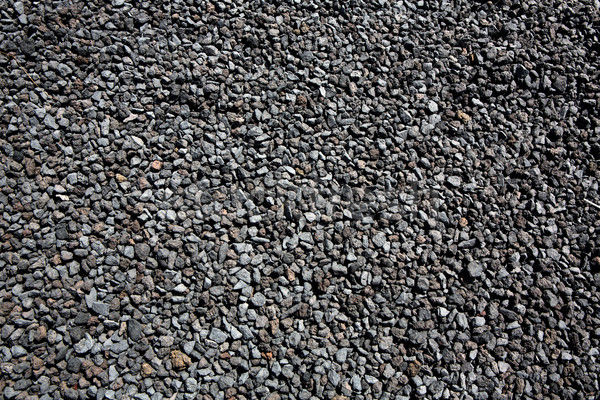 Black volcanic lava stones pattern texture Stock photo © lunamarina