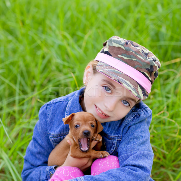 little girl with pet puppy mascot mini pinscher Stock photo © lunamarina