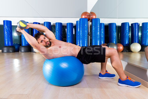 Stock photo: Dumbbell bench press on fit ball man gym workout