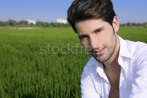 Young man outdoor happy in green meadow Stock photo © lunamarina