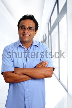 Indian latin businessman blue shirt isolated on white Stock photo © lunamarina