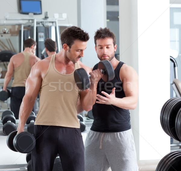 gym personal trainer man with weight training Stock photo © lunamarina