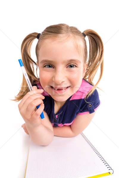 Blond kid girl student with spiral notebook in desk Stock photo © lunamarina