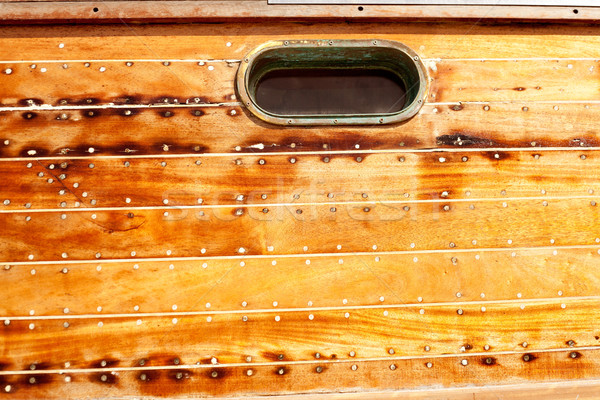 boat oval porthole in wooden hull Stock photo © lunamarina