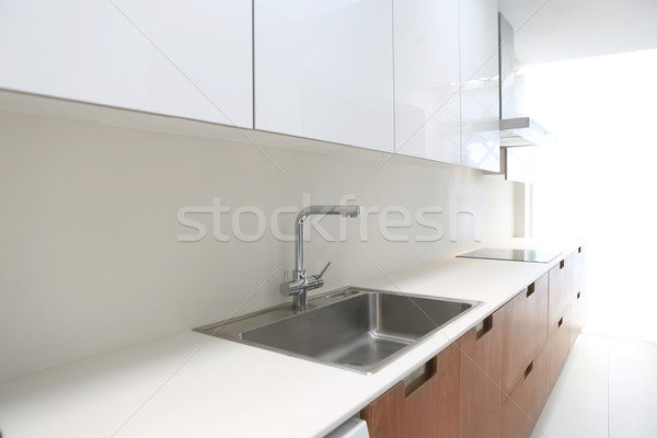 Actual modern kitchen in white and walnut wood Stock photo © lunamarina