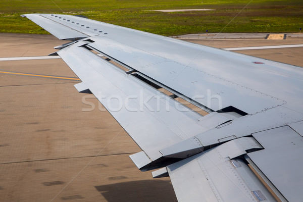 aircraft plane wing taking off on airport Stock photo © lunamarina