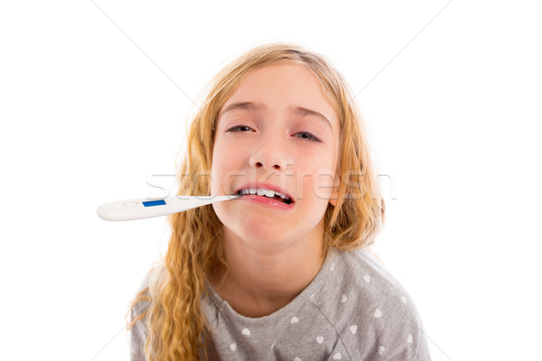 blond girl with thermometer and flu cold in pyjama Stock photo © lunamarina