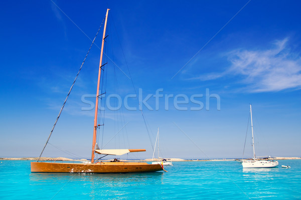  sailboat in turquoise beach of Formentera Stock photo © lunamarina