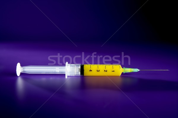 Stock photo: yellow syringe with needle, health, genetics