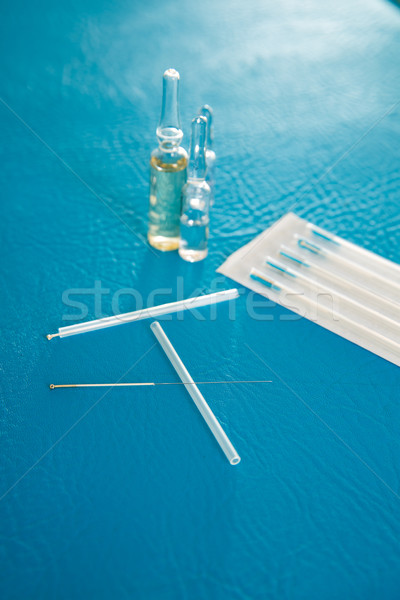 Acupuncture needles set and blister on blue Stock photo © lunamarina