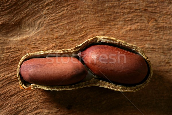 Peanuts macro over wood background Stock photo © lunamarina