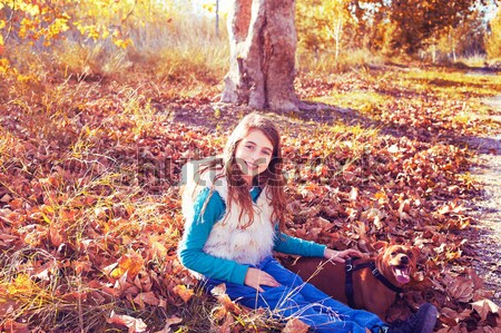 Autumn kid girl with pet dog relaxed in fall forest Stock photo © lunamarina