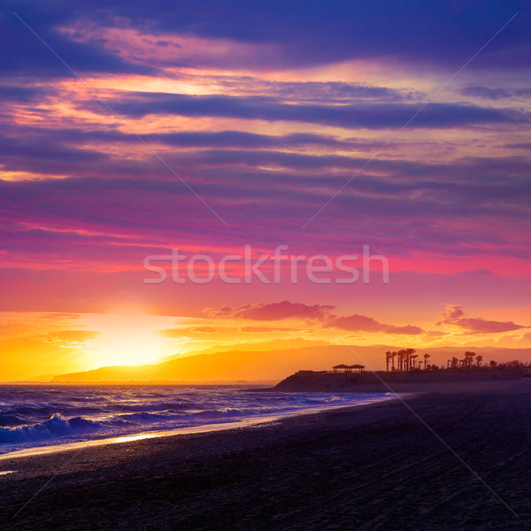 Pôr do sol praia Espanha céu água nuvens Foto stock © lunamarina