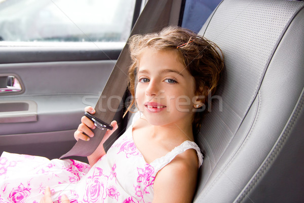 child little girl indoor car putting safety belt Stock photo © lunamarina