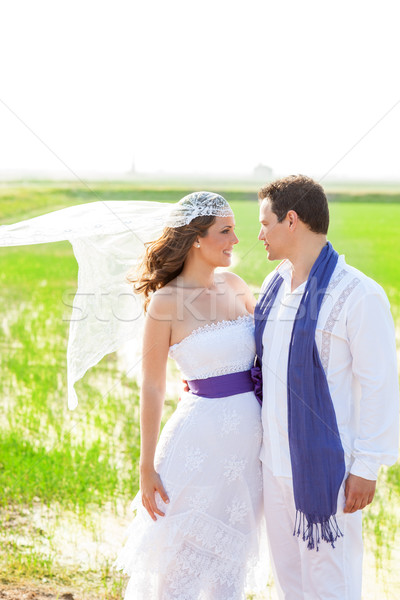 Couple in wedding day with wind on veil Stock photo © lunamarina