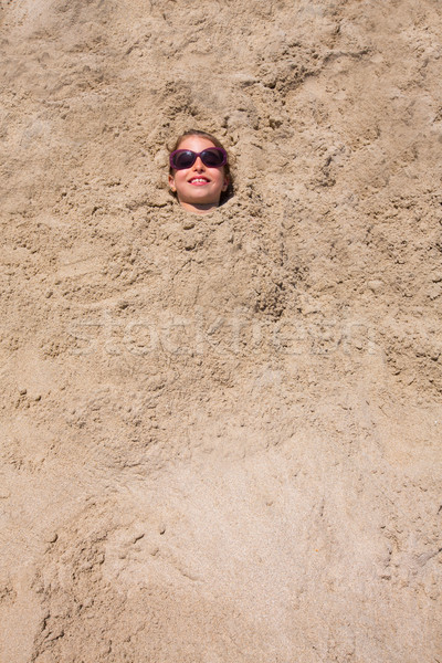 [[stock_photo]]: Drôle · fille · jouer · enterré · plage · de · sable · souriant